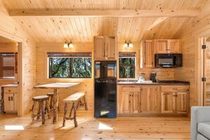 Deluxe Cabin, 2 Bedrooms, Kitchenette | Private kitchen | Full-size fridge, microwave, stovetop, coffee/tea maker - Happy Travelers RV Resort (Thonotosassa)