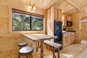 Deluxe Cabin, 2 Bedrooms, Kitchenette | Private kitchen | Full-size fridge, microwave, stovetop, coffee/tea maker - Happy Travelers RV Resort (Thonotosassa)