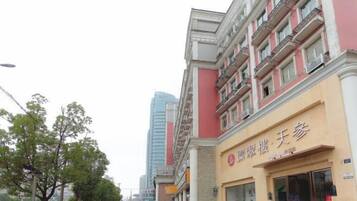 A multi-story building with a commercial ground floor.