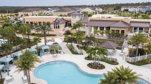 Step into a vibrant resort atmosphere featuring a stunning pool surrounded by lush palm trees and inviting cabanas. The beautifully landscaped grounds create a perfect backdrop for relaxation and fun under the sun.