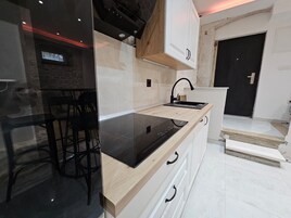 Apartment | Private kitchen | Full-size fridge, microwave, oven, stovetop