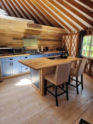 Microwave, stovetop, coffee/tea maker, cookware/dishes/utensils