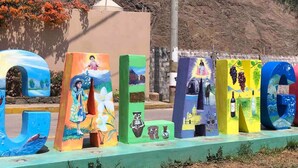 A colorful display of letters with various painted designs.