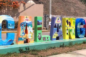 A colorful display of letters with various painted designs.