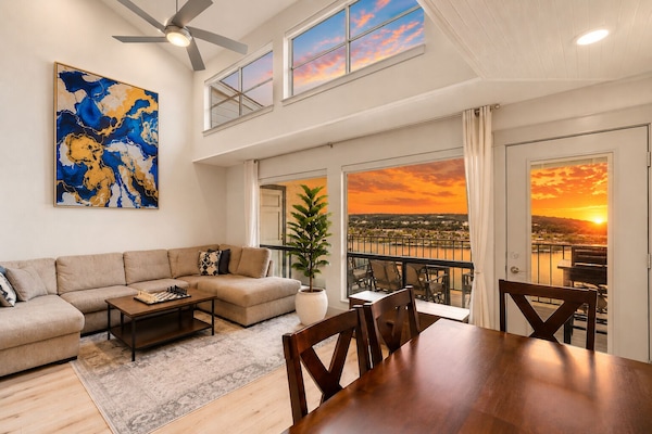 Watch the sun rise over Lake Travis from the living room or either of the privat