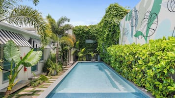 Outdoor pool, open 7:00 AM to 10:00 PM, sun loungers