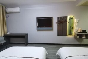 A hotel room with two beds, a desk, a TV, a mirror, and a wardrobe. - Dongzhi IKEA Business Hotel (Dongzhi)