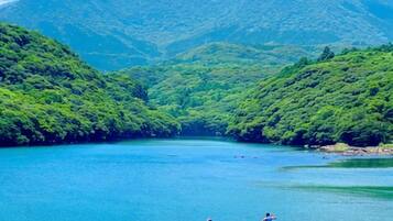 A lake surrounded by lush green hills.
