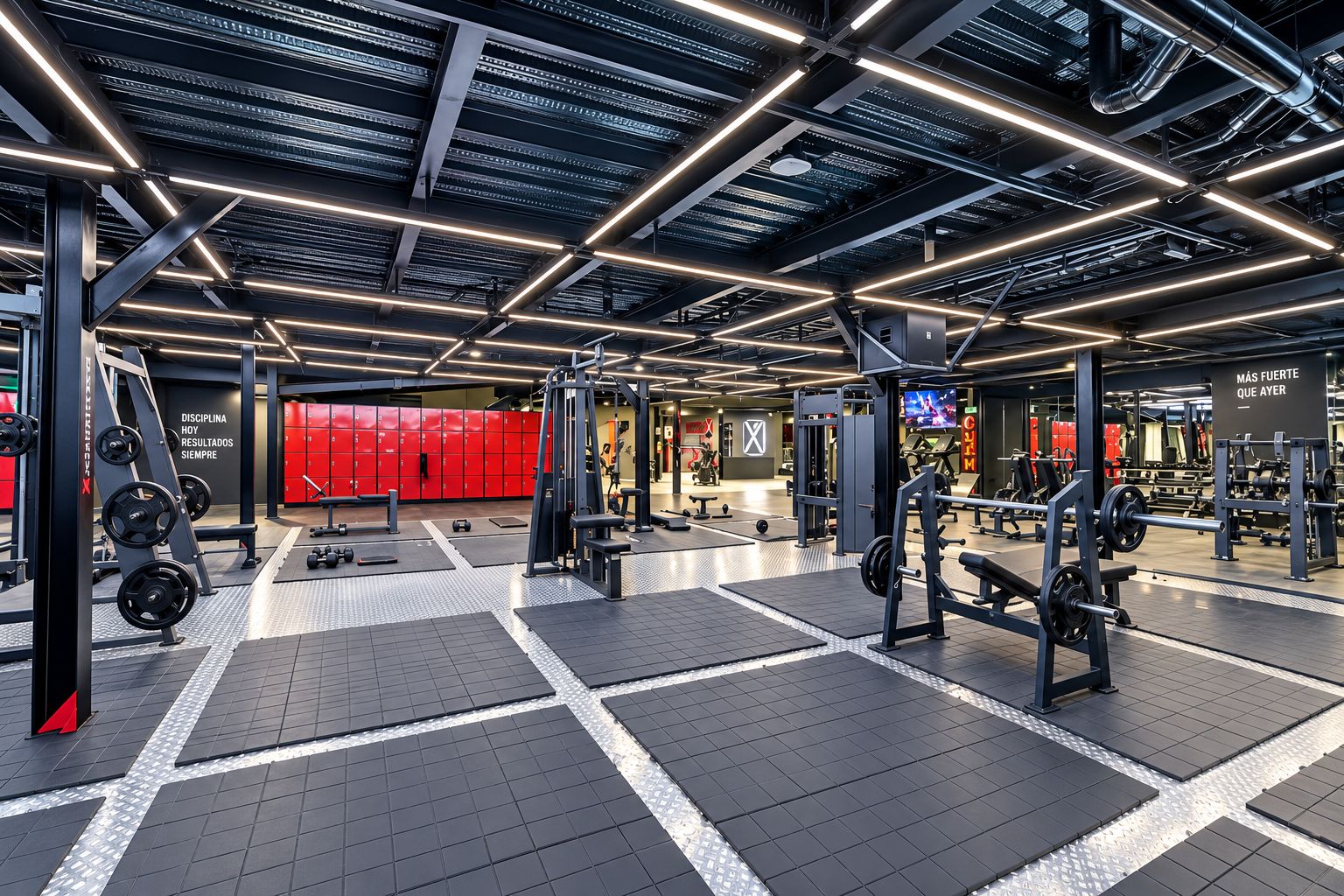 A modern gym with various weightlifting equipment, red lockers, and a motivational slogan on the wall.