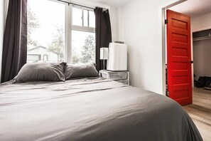 1 bedroom, desk, iron/ironing board, travel crib