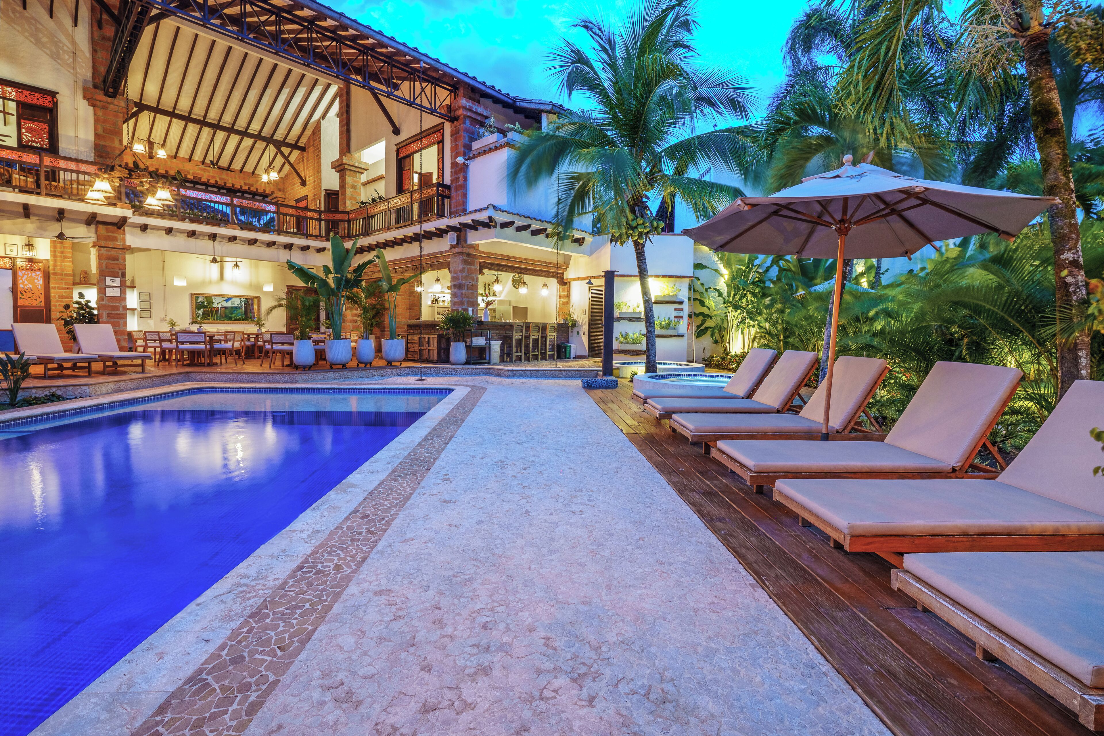 Outdoor pool, open 5:00 PM to 10:30 PM, pool umbrellas, pool loungers