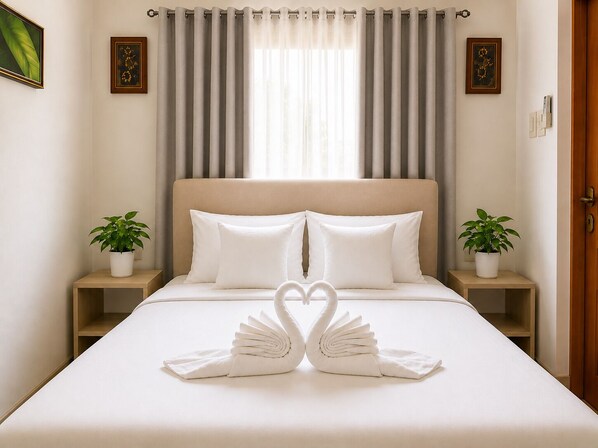 A hotel room with a bed, two nightstands, a headboard, a window with curtains, and two potted plants. - Sky Garden Homestay (Olongapo)
