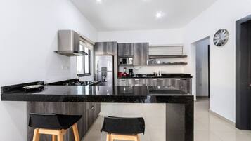 Fridge, microwave, stovetop, coffee/tea maker