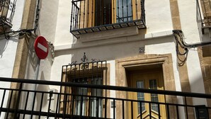 A building with a white facade, multiple balconies, and a no entry sign. - Cervantes in Javea X bia (Javea)