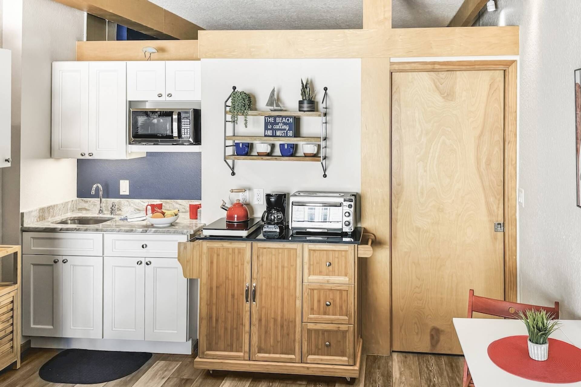 Fridge, microwave, coffee/tea maker, cookware/dishes/utensils