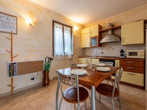 Fridge, oven, cookware/dishes/utensils