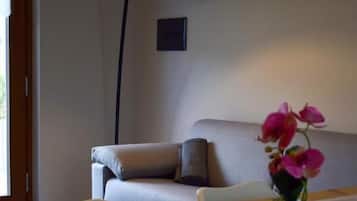 Superior Apartment, Lake View | Living area | 37-inch flat-screen TV with satellite channels, TV, streaming services
