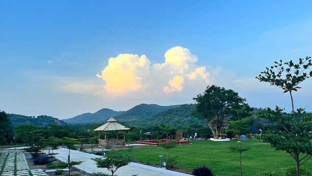 A park with a gazebo, green lawns, and trees. - V NATURE RESORTS (Kanakapura)