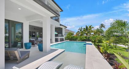 2024 4 Bed Home (Option- Golf Carts Rental) (Car rental option)- Water view with Heated Pool , Outdoor Kitchen/Bar