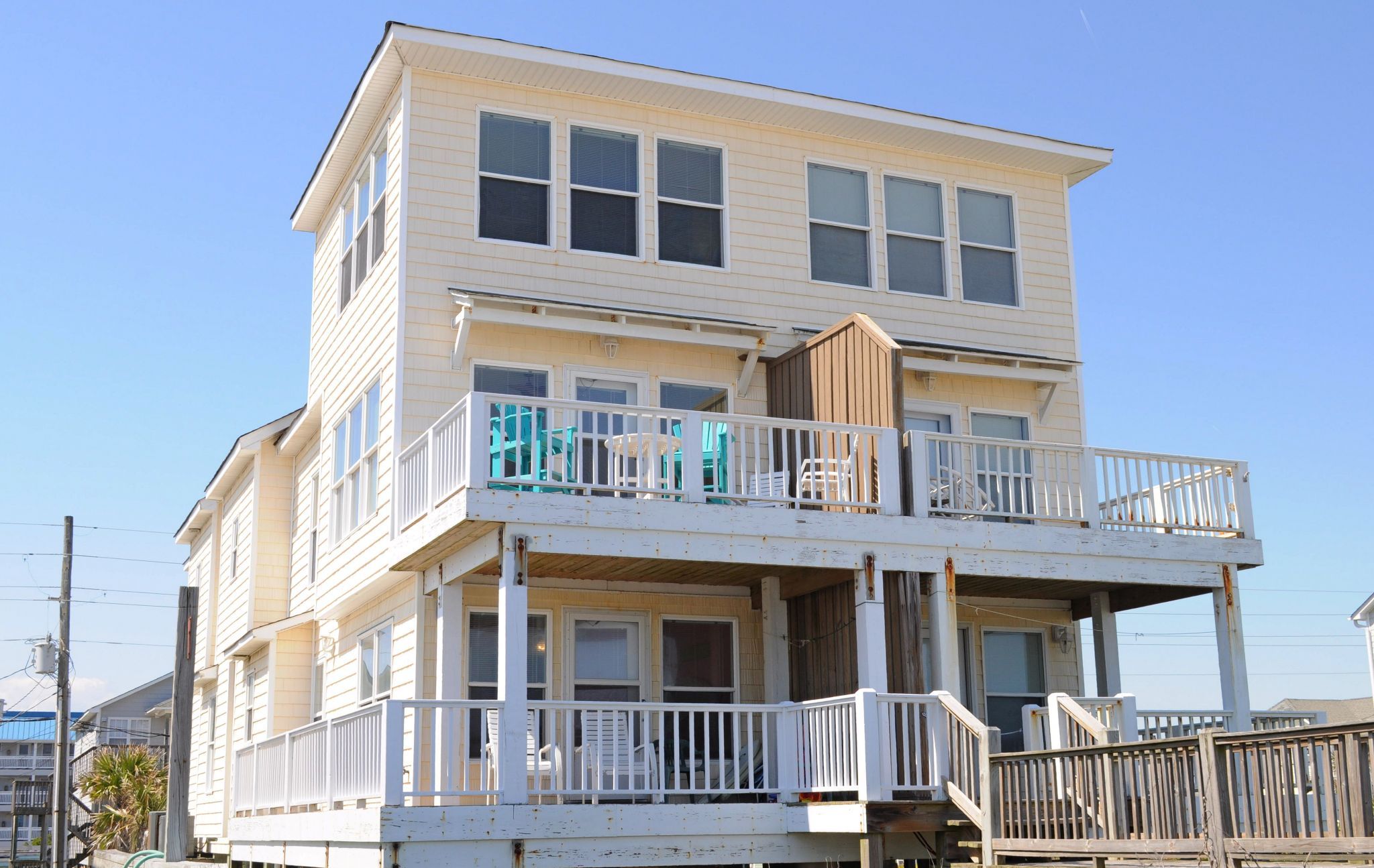 A two-story building with a balcony on the upper level.
