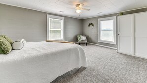 A bedroom with a bed, a ceiling fan, and two windows. - Peaceful Lenoir Home w/ Valley & Mountain Views! (Lenoir)