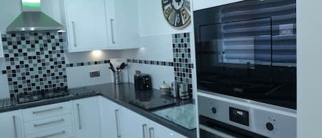 Villa | Private kitchen | Fridge, microwave, oven, stovetop
