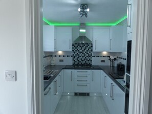 Villa | Private kitchen | Fridge, microwave, oven, stovetop
