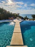 Outdoor pool, open 10:00 AM to 10:00 PM, pool umbrellas, sun loungers