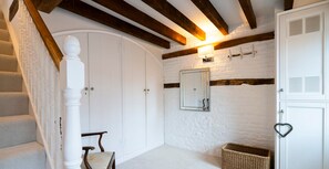 Staircase and traditional furnishings adorn this classic room.