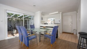 A modern kitchen with white cabinets, a built-in oven, and a microwave. - Escape to Tranquility at Fountain View Villa - South Yunderup (South Yunderup)