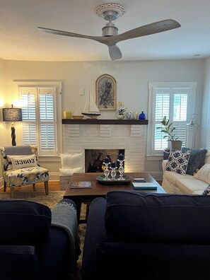 Smart TV, fireplace, books, computer monitors
