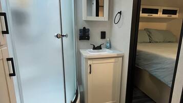 Shower, hair dryer, towels, soap