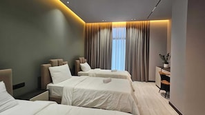 Deluxe Triple Room, Garden View | Premium bedding, memory foam beds, minibar, desk