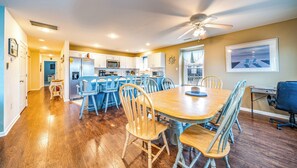 Enjoy meals in this well-appointed dining area with a wooden table and matching chairs.