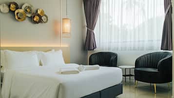 Premium bedding, down comforters, pillowtop beds, free minibar