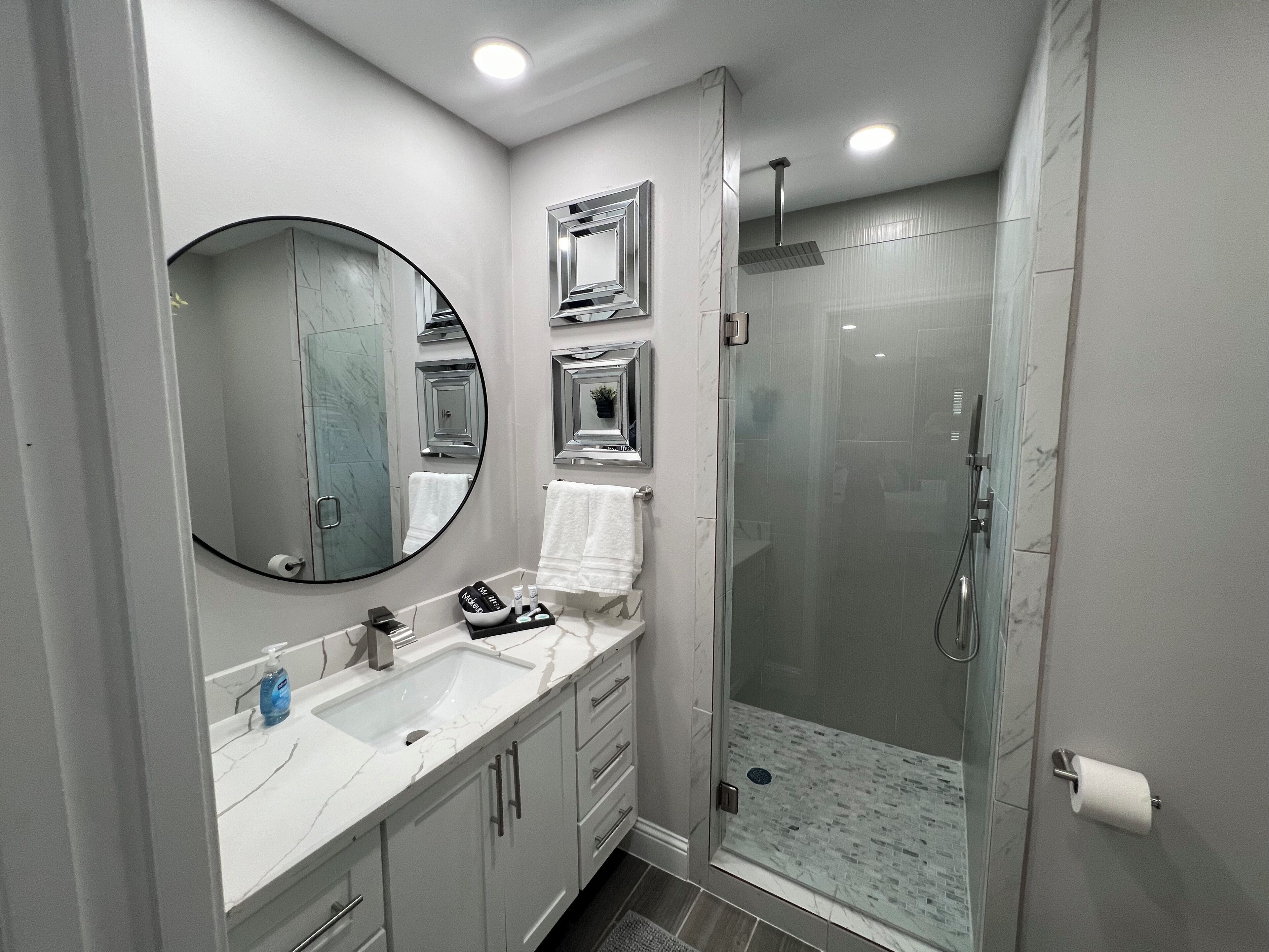 Shower, hair dryer, towels, soap