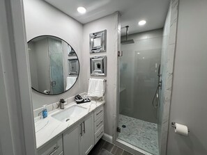 Shower, hair dryer, towels, soap