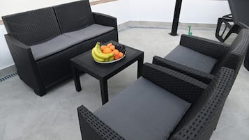Exclusive Villa | Living area | Flat-screen TV