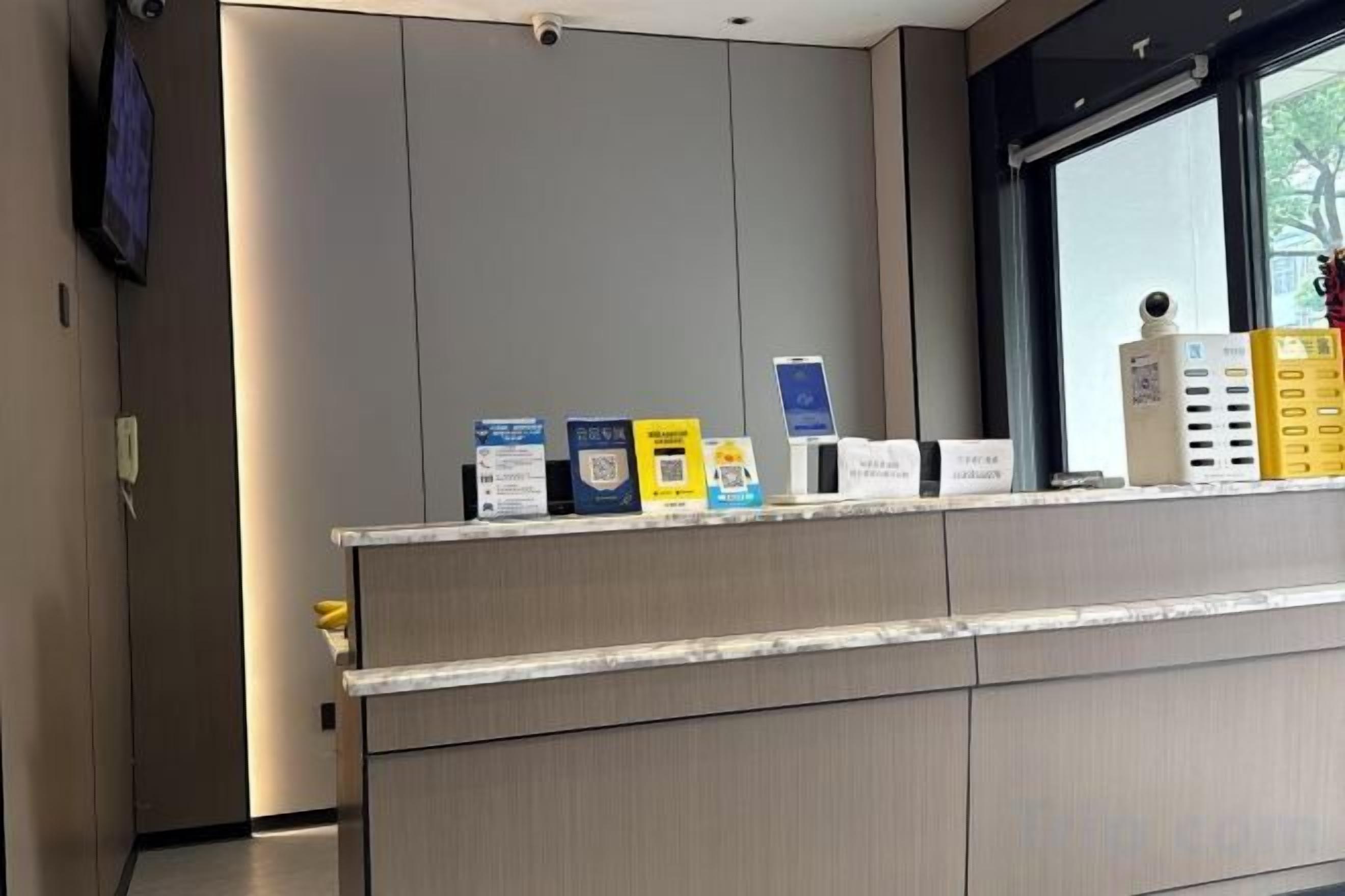 A reception desk with informational brochures and a window view.