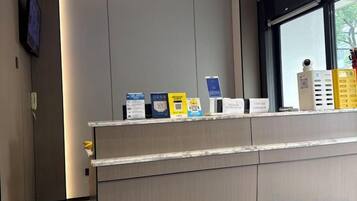 A reception desk with informational brochures and a window view.
