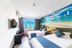 A hotel room with two beds, a desk, a chair, a TV, and a large mural of a beach scene. - Shaoxing Shun'an Collection Hotel (Lu Xun's Hometown Yintai Branch) (Shaoxing)