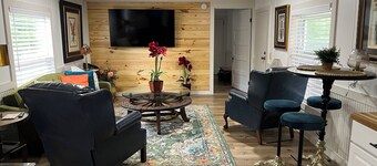 Completely renovated mobile home sitting own a pond. 