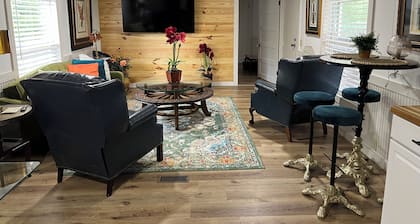 Completely renovated mobile home sitting own a pond.