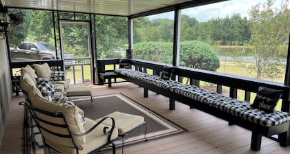 Completely renovated mobile home sitting own a pond.
