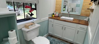 Completely renovated mobile home sitting own a pond. 