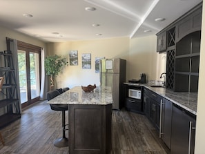 Coffee/tea maker, fridge, microwave, oven