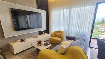 Exclusive Apartment | Living area | Flat-screen TV