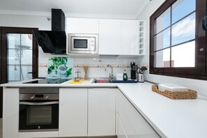 Fridge, microwave, oven, stovetop - Vacation Apartment 'Casa Yare, Shared Pool, Air-con' with Sea View, Wi-Fi and Air Conditioning (Teguise)