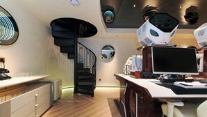 A modern office space with a desk, computer, and a unique ceiling design. - Space Design Hotel (Dalian)