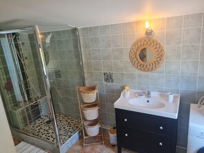 Shower, towels, soap, toilet paper